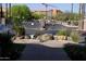 A gated community entrance with lush landscaping, water features, and secure access at 7009 E Acoma Dr # 2013, Scottsdale, AZ 85254