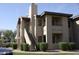 Modern condo building with an exterior staircase and well-maintained landscaping at 7009 E Acoma Dr # 2013, Scottsdale, AZ 85254