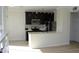 Contemporary kitchen with stainless steel appliances and breakfast bar at 7009 E Acoma Dr # 2013, Scottsdale, AZ 85254