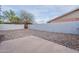 Rock landscaping makes for an inviting backyard with privacy walls and room to entertain at 711 N 22Nd St, Mesa, AZ 85213