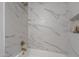 Close up of the white marble bath tub with gold hardware in the bathroom at 711 N 22Nd St, Mesa, AZ 85213