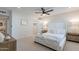 Bright bedroom featuring a ceiling fan, carpet floors, a walk in closet, and natural light at 711 N 22Nd St, Mesa, AZ 85213