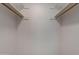 Interior view of closet with built-in shelving and wooden rods, maximizing organization at 711 N 22Nd St, Mesa, AZ 85213