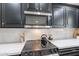 Updated kitchen design showcases stainless steel appliances and plenty of cabinets at 711 N 22Nd St, Mesa, AZ 85213