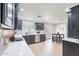 Modern kitchen with dark cabinets, white countertops, and stainless steel appliances at 711 N 22Nd St, Mesa, AZ 85213
