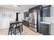 Beautiful kitchen featuring stainless steel refrigerator and modern gray cabinets with an eat-in table at 711 N 22Nd St, Mesa, AZ 85213