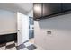 The laundry room is next to the kitchen with black and white tile floors at 711 N 22Nd St, Mesa, AZ 85213