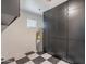 The laundry room features black and white tile flooring and cabinets for storage at 711 N 22Nd St, Mesa, AZ 85213
