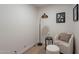 Cozy reading nook featuring a comfortable chair, ottoman, and stylish lighting for relaxation at 711 N 22Nd St, Mesa, AZ 85213
