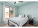 Bedroom featuring queen bed, ceiling fan, window with blinds, and carpeted floor at 7170 W Crystal Rd, Glendale, AZ 85308