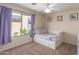 Neutral bedroom featuring a ceiling fan and a window with curtains at 7170 W Crystal Rd, Glendale, AZ 85308