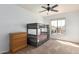 Bedroom featuring bunk bed, large window with neighborhood view, and dresser at 7170 W Crystal Rd, Glendale, AZ 85308