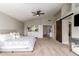 Bright bedroom featuring neutral walls, ceiling fan, and stylish decor at 7170 W Crystal Rd, Glendale, AZ 85308