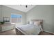 Bright bedroom with natural light, desk and artwork, and a cozy bed at 740 N Bradley Dr, Chandler, AZ 85226