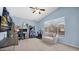 Fun bedroom with gaming setup, desk, and comfortable seating area at 740 N Bradley Dr, Chandler, AZ 85226