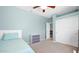 Comfortable bedroom with soft blue walls, ceiling fan, and closet at 740 N Bradley Dr, Chandler, AZ 85226