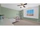Bedroom featuring a ceiling fan, neutral carpet, and a white windowsill at 740 N Bradley Dr, Chandler, AZ 85226