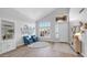 Bright living area featuring hardwood floors, neutral walls, and cozy furnishings at 740 N Bradley Dr, Chandler, AZ 85226