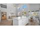 Bright living area features an island, tall ceilings, large windows, and a ceiling fan for added comfort at 740 N Bradley Dr, Chandler, AZ 85226