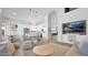 Open-concept kitchen and living area with stainless steel appliances and a breakfast bar at 740 N Bradley Dr, Chandler, AZ 85226