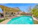 Backyard pool featuring a covered outdoor seating area at 740 N Bradley Dr, Chandler, AZ 85226