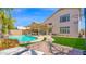 Resort-style backyard with pool, patio, and seating areas at 740 N Bradley Dr, Chandler, AZ 85226