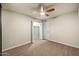 Bedroom featuring neutral walls, ceiling fan and convenient closet storage to meet organizational needs at 7605 N 45Th Dr, Glendale, AZ 85301