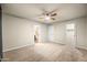 Bedroom with doors to bathroom and closet and ceiling fan providing a calming atmosphere at 7605 N 45Th Dr, Glendale, AZ 85301
