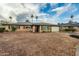 Charming single-story home features a two-car garage, desert landscaping, and blue sky at 7605 N 45Th Dr, Glendale, AZ 85301