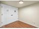 Hallway featuring beautiful wood-look flooring and double doors, ready for your personal touch at 7605 N 45Th Dr, Glendale, AZ 85301