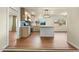 Open kitchen boasts stainless appliances, island, and bright natural light at 7605 N 45Th Dr, Glendale, AZ 85301