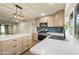 Modern kitchen with island, stainless appliances, gas range, and quartz countertops at 7605 N 45Th Dr, Glendale, AZ 85301