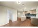 Bright eat-in kitchen features stainless appliances, center island and herringbone tile backsplash at 7605 N 45Th Dr, Glendale, AZ 85301