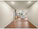 Open concept kitchen and dining area with hardwood floors and neutral paint at 7605 N 45Th Dr, Glendale, AZ 85301
