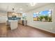 Modern kitchen featuring an island, stainless appliances, gas range, and stylish backsplash at 7605 N 45Th Dr, Glendale, AZ 85301