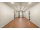 Spacious, naturally lit living room featuring hardwood floors and neutral paint palette at 7605 N 45Th Dr, Glendale, AZ 85301