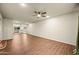 Open living space connects to the kitchen with hardwood floors and neutral walls at 7605 N 45Th Dr, Glendale, AZ 85301