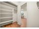 Walk-in pantry with white shelving provides ample storage off the kitchen at 7605 N 45Th Dr, Glendale, AZ 85301