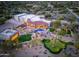 Expansive aerial view showcasing a modern home, lush landscaping, pool, and putting green at 7788 E Morning Vista Ln, Scottsdale, AZ 85266