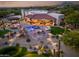 Beautiful aerial view showcases a modern home, landscaped yard, outdoor kitchen and relaxing pool at 7788 E Morning Vista Ln, Scottsdale, AZ 85266