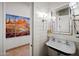 Contemporary bathroom features vintage style sink and faucets, shiplap walls, and naturalistic art at 7788 E Morning Vista Ln, Scottsdale, AZ 85266