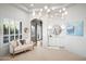 Bright, open bathroom with chandelier, natural light, and modern fixtures creates a serene, spa-like atmosphere at 7788 E Morning Vista Ln, Scottsdale, AZ 85266