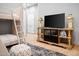 Stylish bedroom with bunk beds, neutral color palette, and a decorative TV stand at 7788 E Morning Vista Ln, Scottsdale, AZ 85266