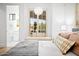 Bright bedroom featuring a window seat, designer accents, and a modern aesthetic at 7788 E Morning Vista Ln, Scottsdale, AZ 85266