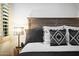 Well appointed bedroom with luxury linens, side table and lamp, offering an inviting atmosphere at 7788 E Morning Vista Ln, Scottsdale, AZ 85266