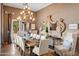 Traditional dining room with seating for ten, chandelier, and sophisticated decor for entertaining at 7788 E Morning Vista Ln, Scottsdale, AZ 85266