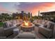 Outdoor fire pit with a built-in seating area, perfect for entertaining at 7788 E Morning Vista Ln, Scottsdale, AZ 85266