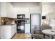 Efficient kitchen with stainless steel appliances, granite countertops, and adjacent dining area at 7788 E Morning Vista Ln, Scottsdale, AZ 85266