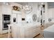 Bright kitchen with white cabinetry, marble countertops, large island, and stainless steel appliances at 7788 E Morning Vista Ln, Scottsdale, AZ 85266