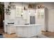 Charming kitchen featuring custom cabinetry, marble countertops, and a stainless steel refrigerator at 7788 E Morning Vista Ln, Scottsdale, AZ 85266